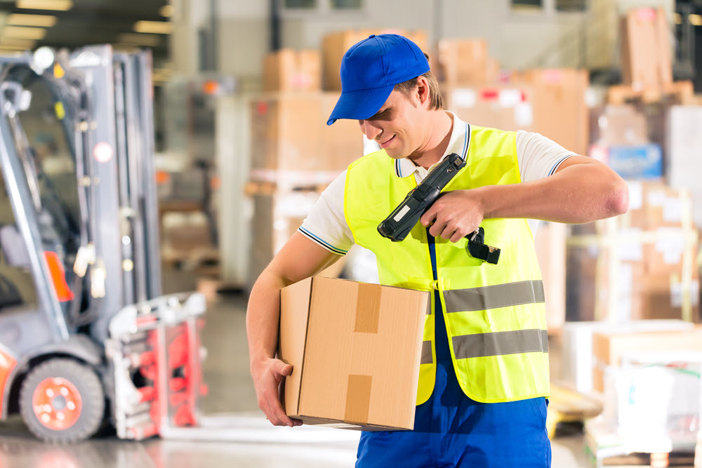 Man with scanner and box