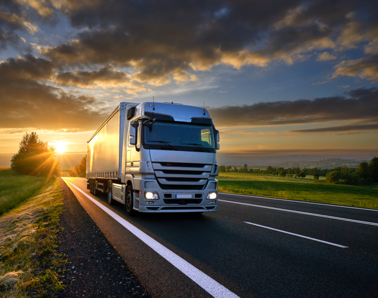 Truck on road sunset