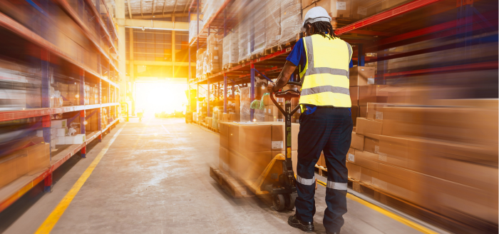 Warehouse with operator and sunset